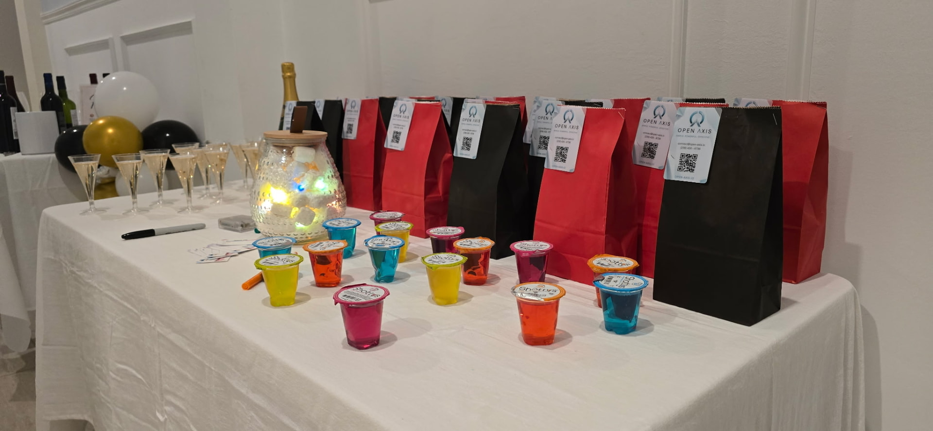 Champagne flutes and branded gift bags prepared for arriving guests